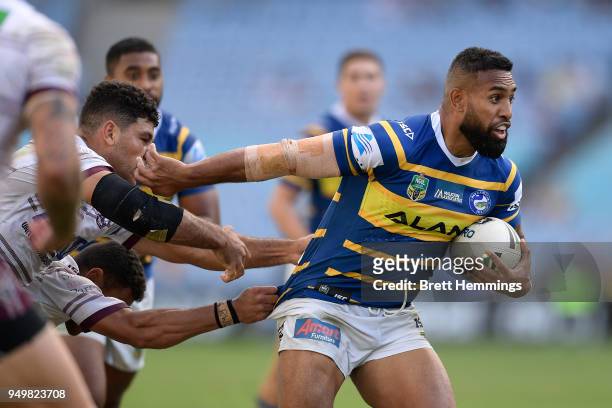 George Jennings of the Eels is tackled during the round seven NRL match between the Parramatta Eels and the Manly Sea Eagles at ANZ Stadium on April...