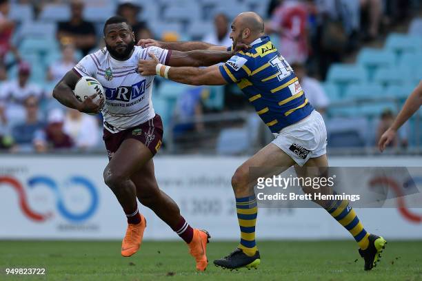 Akuila Uate of Manly is tackled during the round seven NRL match between the Parramatta Eels and the Manly Sea Eagles at ANZ Stadium on April 22,...