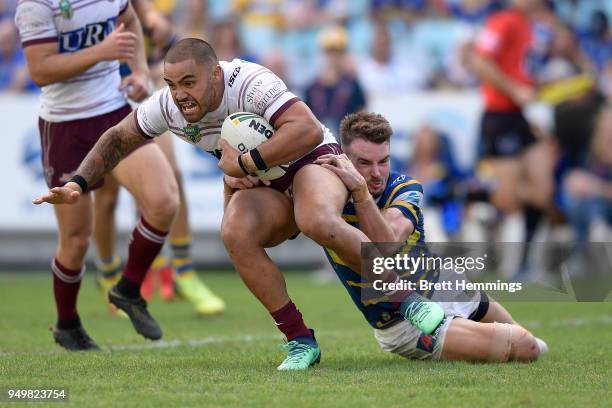 Dylan Walker of Manly is tackled during the round seven NRL match between the Parramatta Eels and the Manly Sea Eagles at ANZ Stadium on April 22,...