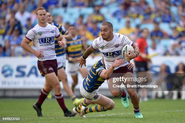 Dylan Walker of Manly is tackled during the round seven NRL match between the Parramatta Eels and the Manly Sea Eagles at ANZ Stadium on April 22,...