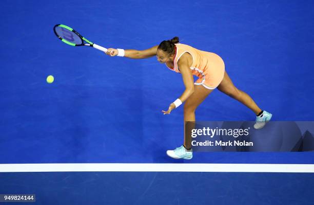 Lesley Kerkhove of the Netherlands plays a forehand in her match against Ashleigh Barty of Australia during the World Group Play-Off Fed Cup tie...