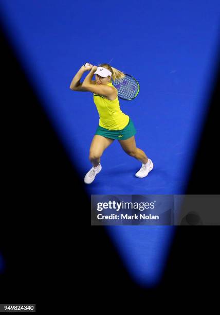 Daria Gavrilova of Australia plays a backhand in her match against Quirine Lemoine of the Netherlands during the World Group Play-Off Fed Cup tie...