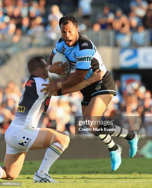 Joseph Paulo of the Sharks is tackled by Trent Merrin of the Panthers during the round seven NRL match between the Cronulla Sharks and the Penrith...