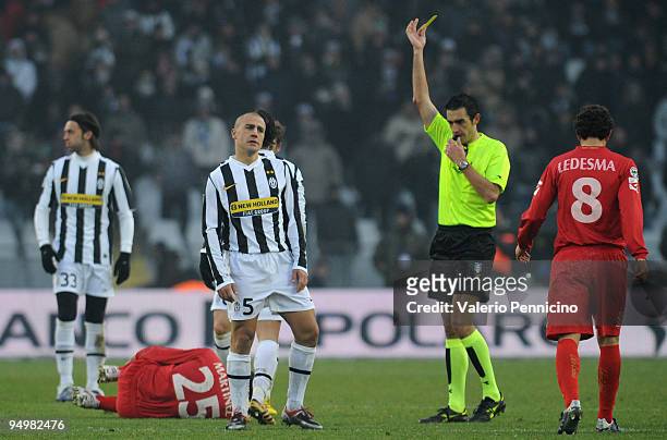 Fabio Cannavaro of Juventus FC receives the yellow card from referee Nicola Pierpaoli during the Serie A match between Juventus FC and Catania Calcio...