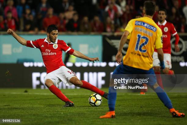 Benfica's Mexican forward Raul Jimenez shoots the ball during the Portuguese League football match between Estoril Praia and SL Benfica at Antonio...
