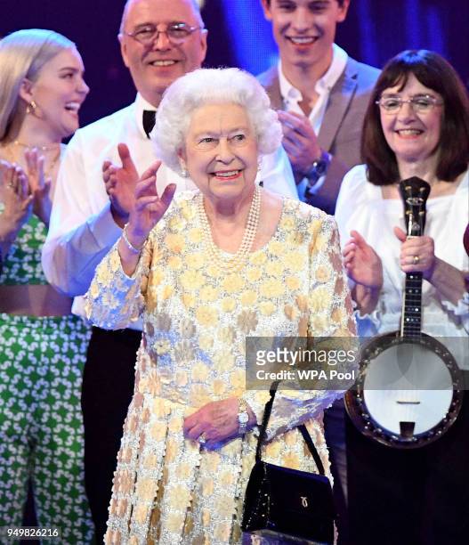 Queen Elizabeth II acknowledges the audience after a speech by Prince Charles, Prince of Wales at the end of a star-studded concert to celebrate the...