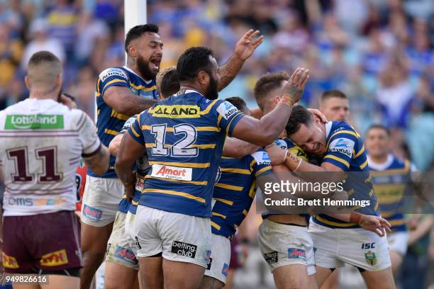Clinton Gutherson of the Eels celebrates scoring a try with team mates during the round seven NRL match between the Parramatta Eels and the Manly Sea...
