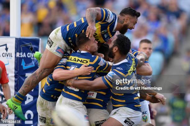 Clinton Gutherson of the Eels celebrates scoring a try with team mates during the round seven NRL match between the Parramatta Eels and the Manly Sea...