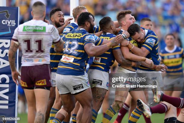 Clinton Gutherson of the Eels celebrates scoring a try with team mates during the round seven NRL match between the Parramatta Eels and the Manly Sea...