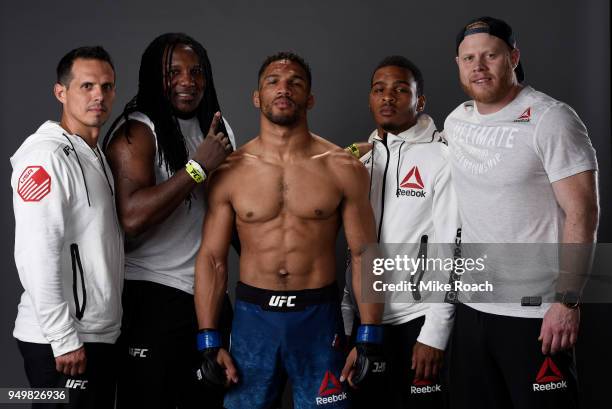 Kevin Lee poses for a portrait backstage with his team after his victory over Edson Barboza during the UFC Fight Night event at the Boardwalk Hall on...