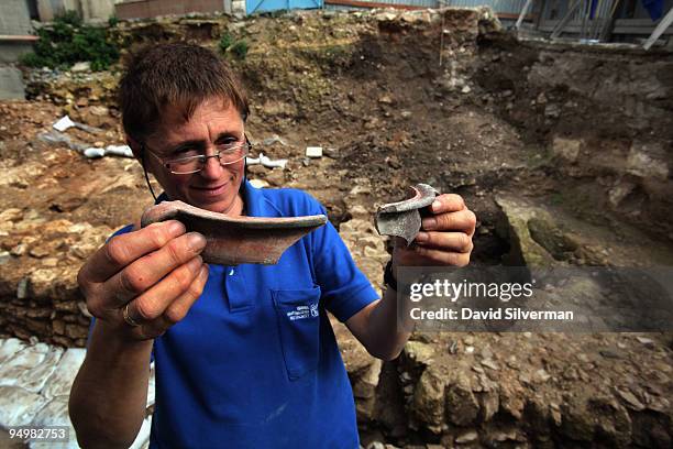 Israeli archaeologist Yardenna Alexandre inspects Roman 1st century AD pottery found in an excavation which reveals for the first time a Jesus-era...