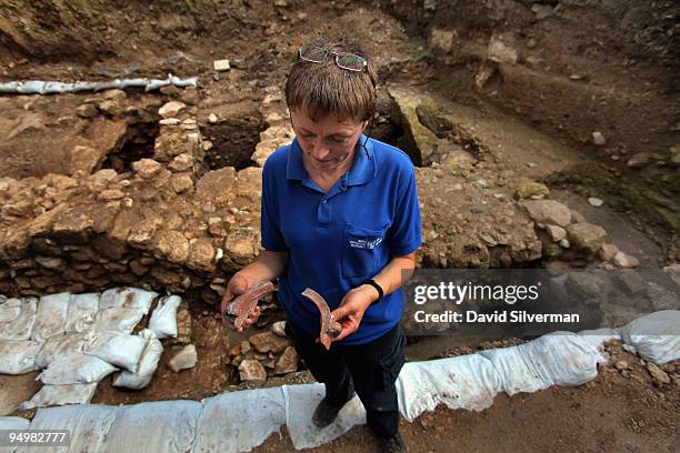 Israeli archaeologist Yardenna Alexandre inspects Roman 1st century AD pottery found in an excavation which reveals for the first time a Jesus-era...