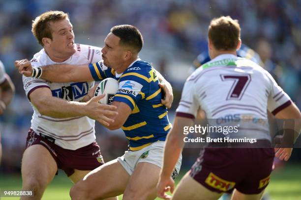 Corey Norman of the Eels is tackled during the round seven NRL match between the Parramatta Eels and the Manly Sea Eagles at ANZ Stadium on April 22,...