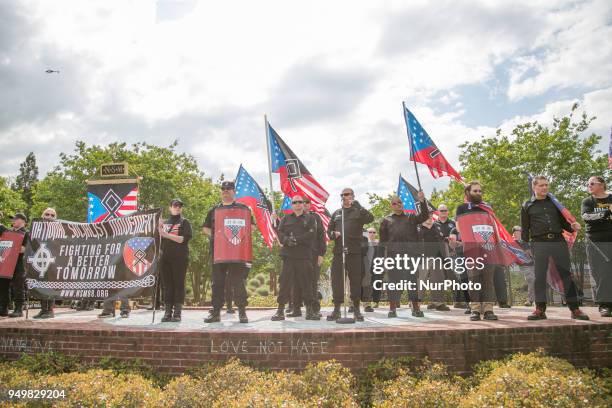 Neo-Nazis stand onstage during a National Socialist Movement rally at Greenville Street Park in Newnan, Georgia, USA on April 21, 2018.