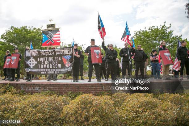 Neo-Nazis stand onstage during a National Socialist Movement rally at Greenville Street Park in Newnan, Georgia, USA on April 21, 2018.