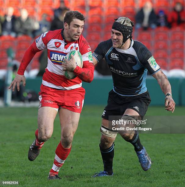 Nicky Robinson of Gloucester moves away from Kelly Brown during the Heineken Cup match between Gloucester and Glasgow Warriors at Kingsholm on...