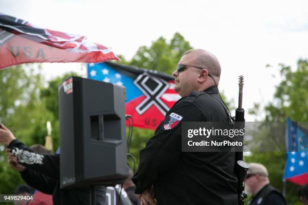 Neo-Nazi wears a gun during a National Socialist Movement rally at Greenville Street Park in Newnan, Georgia, USA on April 21, 2018.