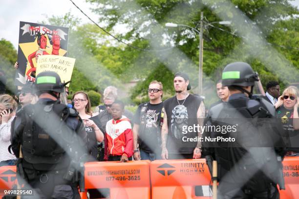 Protesters stand otuside a National Socialist Movement rally at Greenville Street Park in Newnan, Georgia, USA on April 21, 2018.
