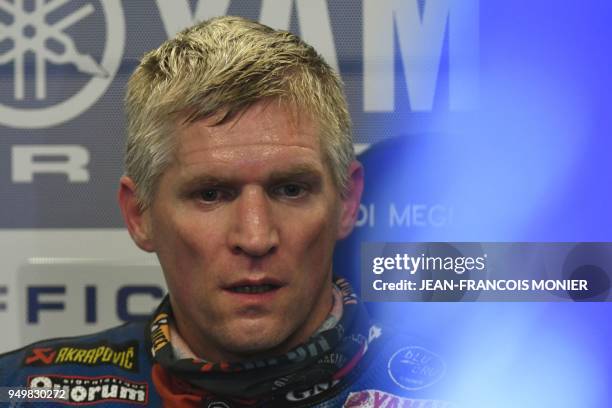 Spanish David Checa reacts in his pit following his crash and as he lost the first place after 470 laps in the lead of the 41st Le Mans 24-hours...