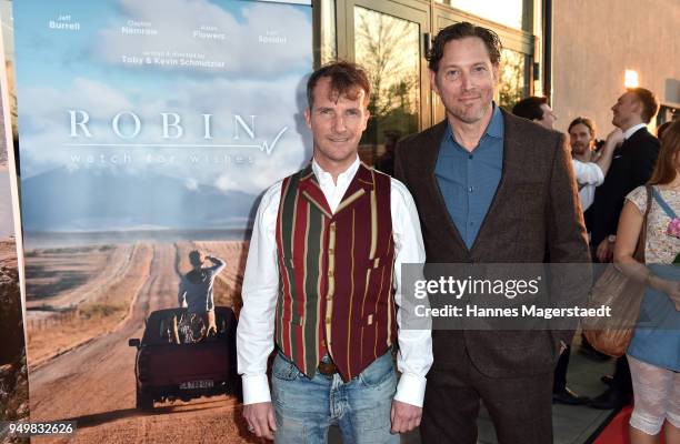 Actor Jeff Burrell and Clayton Nemrow attend 'Robin: Watch for Wishes' premiere at Cinestar on April 21, 2018 in Ingolstadt, Germany.