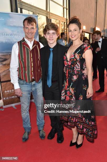 Actor Jeff Burrell, Aiden Flowers and Leni Speidel attend 'Robin: Watch for Wishes' premiere at Cinestar on April 21, 2018 in Ingolstadt, Germany.