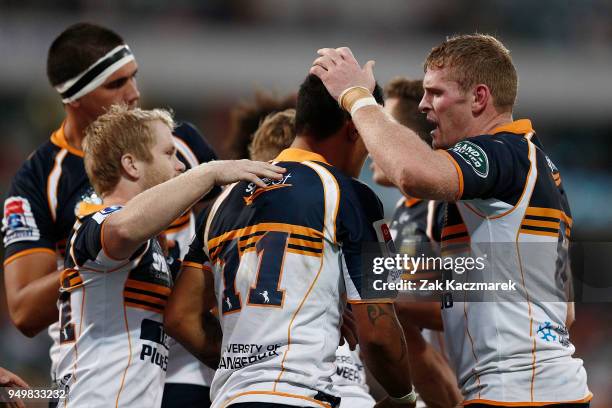 The Brumbies celebrate after Chance Peni of the Brumbies scored a try during the round 10 Super Rugby match between the Brumbies and the Jaguares at...