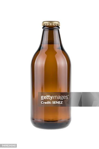 close-up of bottle against white background - brown bottle stock pictures, royalty-free photos & images