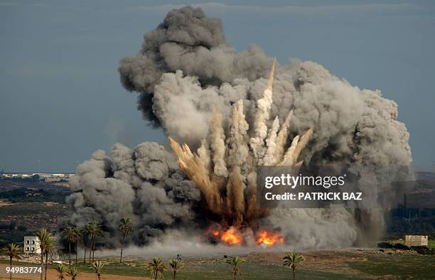 Picture taken from the Israeli side of the border with the Gaza Strip shows a bomb dropped by an Israeli air force F-16 jet exploding in Beit Hanoun,...