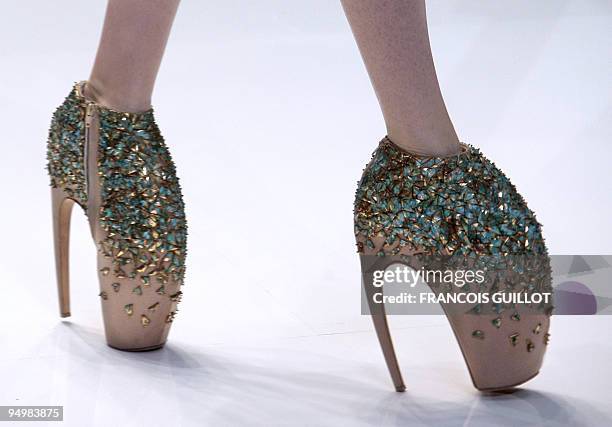 Model presents an outfit by British designer Alexander McQueen during ready-to-wear Spring-Summer 2010 fashion show on October 6, 2009 in Paris. AFP...