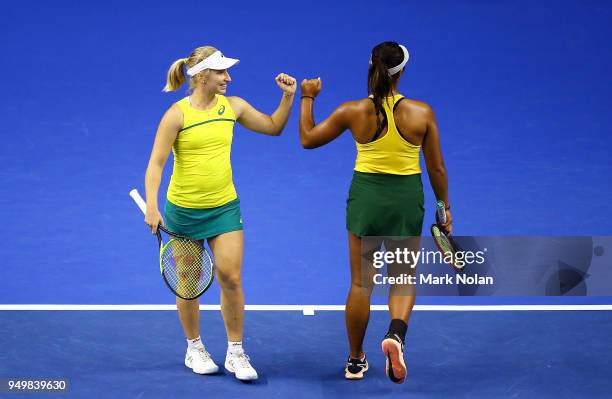 Destanee Aiava and Daria Gavrilova of Australia celebrate a point in the doubles match against Lesley Kerkhove and Demi Schuurs of the Netherlands...