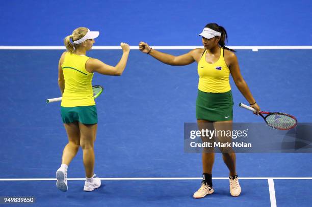 Destanee Aiava and Daria Gavrilova of Australia celebrate a point in the doubles match against Lesley Kerkhove and Demi Schuurs of the Netherlands...