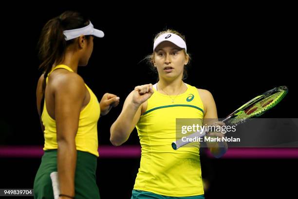 Destanee Aiava and Daria Gavrilova of Australia celebrate a point in the doubles match against Lesley Kerkhove and Demi Schuurs of the Netherlands...