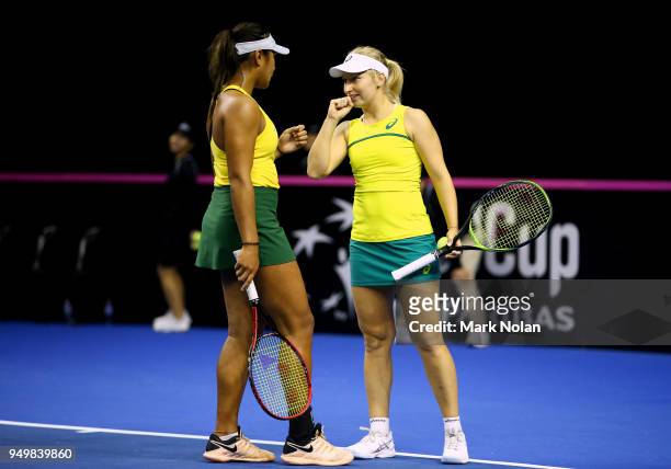 Destanee Aiava and Daria Gavrilova of Australia talk in the doubles match against Lesley Kerkhove and Demi Schuurs of the Netherlands during the...