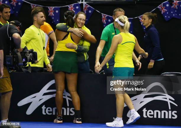 Destanee Aiava and Daria Gavrilova of Australia celebrate with team mates after winning the doubles match against Lesley Kerkhove and Demi Schuurs of...