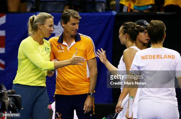 Australian captain Alicia Molik and Netherlands captain Paul Haarhuis greet players after the World Group Play-Off Fed Cup tie between Australia and...