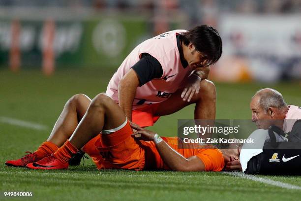 Ramiro Moyano of the Jaguares receives medical treatment after sustaining an injury to his neck during the round 10 Super Rugby match between the...