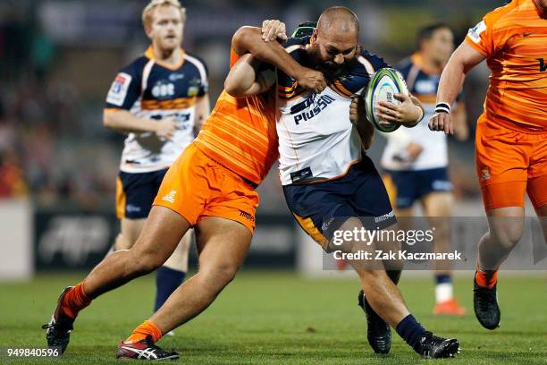 Robbie Abel of the Brumbies is tackled by Guido Petti of the Jaguares during the round 10 Super Rugby match between the Brumbies and the Jaguares at...