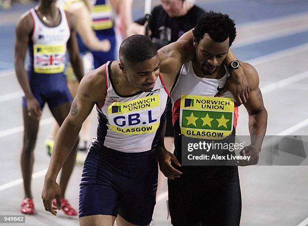 Mark Lewis-Francis of Great Britain with Gregory Saddler of the USA after the Mens 60m at the Norwich Union International at Kelvin Hall in Glasgow,...