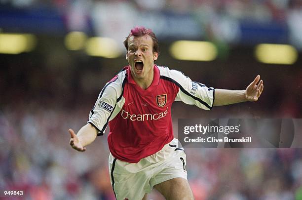 Fredrik Ljungberg of Arsenal celebrates scoring the opening goal in the AXA Sponsored FA Cup Final against Liverpool at the Millennium Stadium in...