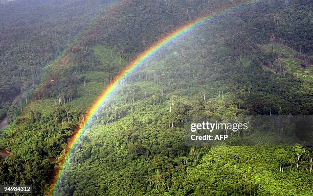 Rainbow forms over the Ulu Baram rainforest in the Miri interior, eastern Malaysian Borneo state of Sarawak, 13 December 2007. Wealthy countries and...