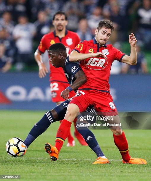 Leroy George of the Victory and Isaas of Adelaide United contest the ball during the A-League Elimination Final match between Melbourne Victory and...