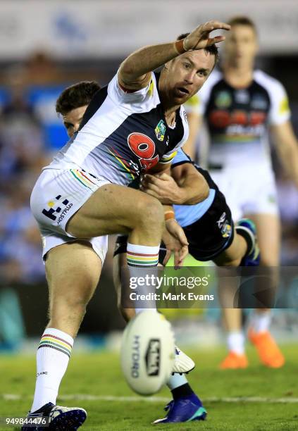 James Maloney of the Panthers is tackled by Chad Townsend of the Sharks during the round seven NRL match between the Cronulla Sharks and the Penrith...