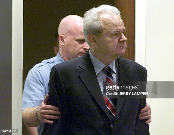Former Yugoslav president Slobodan Milosevic is led into the courtroom of the UN War Crimes Tribunal in The Hague 03 July for his first appearance...