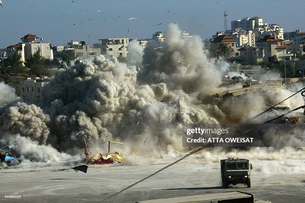 The Israeli army blows up a building in