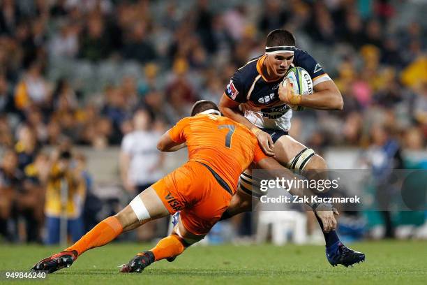 Darcy Swain of the Brumbies is tackled by Marcos Kremer of the Jaguares during the round 10 Super Rugby match between the Brumbies and the Jaguares...