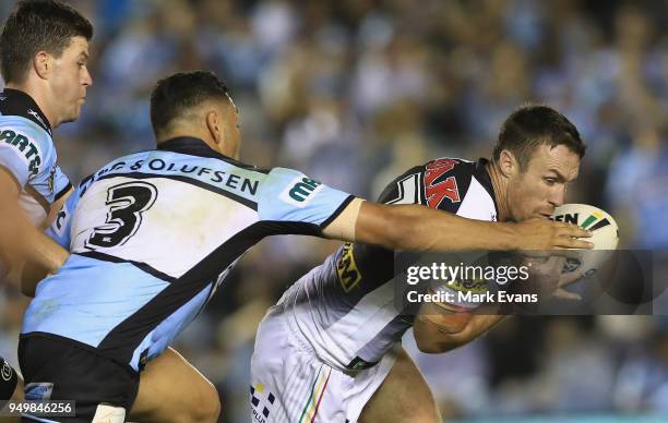 James Maloney of the Panthers is tacked by Jesse Ramien of the Sharks during the round seven NRL match between the Cronulla Sharks and the Penrith...