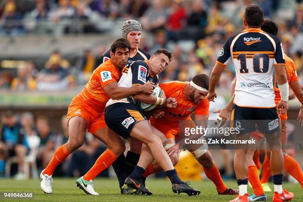 Tom Banks of the Brumbies is tackled during the round 10 Super Rugby match between the Brumbies and the Jaguares at University of Canberra Stadium on...