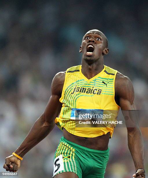 Jamaica's Usain Bolt celebrates winning the men's 200m final at the "Bird's Nest" National Stadium during the 2008 Beijing Olympic Games on August...