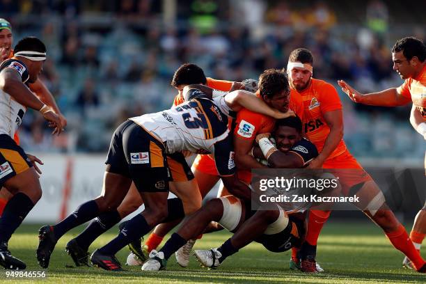 Isi Naisarani of the Brumbies is tackled during the round 10 Super Rugby match between the Brumbies and the Jaguares at University of Canberra...