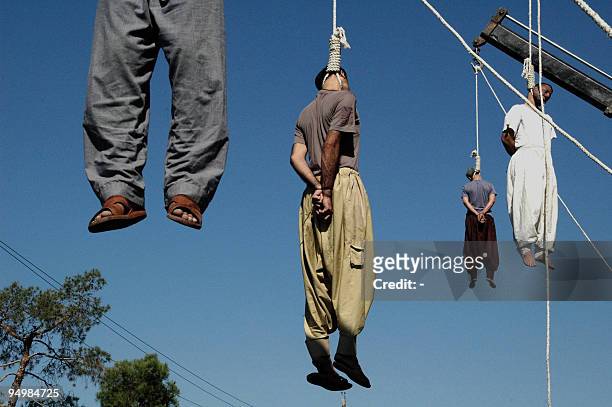 Four Iranian criminals are hanged in public in the southern city of Shiraz, 950 kms south of Tehran, 05 September 2007. Iran executed today 21...
